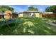Fenced backyard features a storage shed, mature trees, and an activity center at 1570 S Harriet St, Martinsville, IN 46151