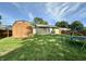 Large backyard featuring a storage shed, playset, and plenty of open space at 1570 S Harriet St, Martinsville, IN 46151