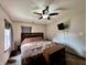 Bedroom with neutral walls, ceiling fan, tv, and carpeted floors at 1570 S Harriet St, Martinsville, IN 46151