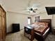Bedroom with neutral walls, ceiling fan, tv, and carpeted floors at 1570 S Harriet St, Martinsville, IN 46151
