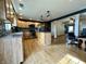 Open-concept kitchen with stainless steel appliances and hardwood floors at 1570 S Harriet St, Martinsville, IN 46151