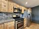 Modern kitchen features stainless steel appliances, granite countertops, and light wood cabinetry at 1570 S Harriet St, Martinsville, IN 46151