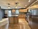 Open kitchen featuring custom cabinets, stainless steel appliances, and central island at 1570 S Harriet St, Martinsville, IN 46151