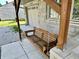 Charming front porch with a wooden swing, perfect for relaxing outdoors at 1570 S Harriet St, Martinsville, IN 46151