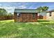 Backyard featuring a wooden shed with a green roof and a fenced perimeter at 1570 S Harriet St, Martinsville, IN 46151