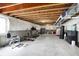Unfinished basement with exposed ceiling, concrete floor, and workout equipment at 15717 Hush Hickory, Westfield, IN 46074