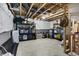 Spacious unfinished basement area with shelving, open ceiling and concrete floor, great for storage and customization at 15717 Hush Hickory, Westfield, IN 46074