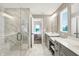 Bright bathroom with a glass-enclosed marble shower next to the vanity, flowing into the main bedroom at 15717 Hush Hickory, Westfield, IN 46074