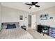 Neutral bedroom featuring a ceiling fan, carpet, and art at 15717 Hush Hickory, Westfield, IN 46074