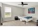 Modern bedroom featuring a ceiling fan, carpet, and natural light from the window at 15717 Hush Hickory, Westfield, IN 46074