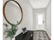 Welcoming entryway featuring a modern mirror, stylish console table, and a decorative rug leading to the front door at 15717 Hush Hickory, Westfield, IN 46074