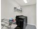 Laundry room featuring new black washer and dryer and nice tile floor at 15717 Hush Hickory, Westfield, IN 46074