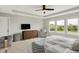 Bright main bedroom with multiple windows, tray ceiling, and a dresser for comfortable modern living at 15717 Hush Hickory, Westfield, IN 46074