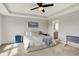 Spacious main bedroom features tray ceilings and flows into a lovely ensuite bathroom for easy access at 15717 Hush Hickory, Westfield, IN 46074