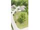 An aerial view of a residential community with well-maintained homes and lush greenery at 1713 Deer Creek Way, Columbus, IN 47201