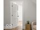 Modern interior featuring a three-panel white door, neutral walls, and hardwood flooring at 1713 Deer Creek Way, Columbus, IN 47201