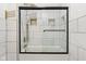 Bathroom featuring tile and glass shower door, sleek hardware, and bright lighting at 1804 Spann Ave, Indianapolis, IN 46203