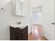 Bathroom with modern vanity, stylish fixtures, and an open doorway at 1804 Spann Ave, Indianapolis, IN 46203