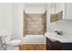 Cozy bathroom featuring tile surround, integrated shower, and a classic vanity at 1804 Spann Ave, Indianapolis, IN 46203