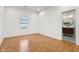 Charming bedroom filled with light has neutral paint, hardwood floors, and ensuite bath at 1804 Spann Ave, Indianapolis, IN 46203