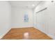 Cozy bedroom boasts hardwood floors, a window, and a closet for ample storage at 1804 Spann Ave, Indianapolis, IN 46203