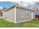 The back of the home features modern siding and a backyard with green grass at 1804 Spann Ave, Indianapolis, IN 46203