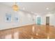 Spacious living room with hardwood floors and lots of natural light from large windows at 1804 Spann Ave, Indianapolis, IN 46203