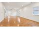 Bright and airy living room showcasing gleaming hardwood floors and neutral paint at 1804 Spann Ave, Indianapolis, IN 46203