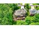 Aerial view of private backyard featuring large deck, pergola and professional landscaping at 1860 Red Fox E Ct, Martinsville, IN 46151