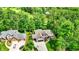 Aerial view of neighborhood houses surrounded by lush green trees at 1860 Red Fox E Ct, Martinsville, IN 46151