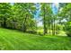 Scenic backyard with lush greenery; Golf course visible in background at 1860 Red Fox E Ct, Martinsville, IN 46151