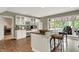 Basement bar area with sink, stools, and view to the deck at 1860 Red Fox E Ct, Martinsville, IN 46151