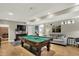 Finished basement featuring a billiards table, providing ample space for entertainment and recreation at 1860 Red Fox E Ct, Martinsville, IN 46151