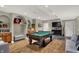 Finished basement with a pool table, seating, and stylish decor for entertainment and relaxation at 1860 Red Fox E Ct, Martinsville, IN 46151