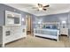 Cozy bedroom features blue walls, white furniture, and soft lighting for a relaxing atmosphere at 1860 Red Fox E Ct, Martinsville, IN 46151