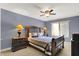 Bedroom with dark wood furniture, neutral carpet, and a ceiling fan at 1860 Red Fox E Ct, Martinsville, IN 46151
