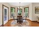 Cozy dining area with beautiful natural lighting, modern light fixture and trim at 1860 Red Fox E Ct, Martinsville, IN 46151