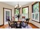 Cozy dining area with beautiful natural lighting and detailed wood trim at 1860 Red Fox E Ct, Martinsville, IN 46151