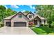 Charming two-story brick home with well-manicured lawn and attached two-car garage at 1860 Red Fox E Ct, Martinsville, IN 46151