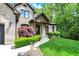 Beautiful brick home with mature landscaping, a manicured lawn, and an inviting front entrance at 1860 Red Fox E Ct, Martinsville, IN 46151
