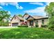 Well maintained brick home with lush green lawn and mature trees at 1860 Red Fox E Ct, Martinsville, IN 46151