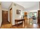 Hardwood foyer leading to a dining area and kitchen; natural light fills the space at 1860 Red Fox E Ct, Martinsville, IN 46151