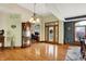 Elegant foyer features hardwood floors, a vintage grandfather clock and decorative glass front door at 1860 Red Fox E Ct, Martinsville, IN 46151
