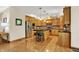 Well lit kitchen with stainless appliances, wooden cabinets, an island, and hardwood floors at 1860 Red Fox E Ct, Martinsville, IN 46151