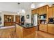 Spacious kitchen features wood cabinets, stainless appliances and a large center island with a granite countertop at 1860 Red Fox E Ct, Martinsville, IN 46151