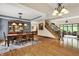 Open-concept space with dining area, staircase, and living room with fireplace feature at 1860 Red Fox E Ct, Martinsville, IN 46151