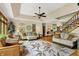 Inviting living room with hardwood floors, a comfortable sofa, and staircase at 1860 Red Fox E Ct, Martinsville, IN 46151