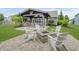 Beautiful backyard featuring a fire pit, grill, and covered seating area, perfect for outdoor entertaining at 18630 Goldwater Rd, Westfield, IN 46062