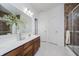 Modern bathroom featuring a double vanity, a glass shower, and warm-toned tiles at 18630 Goldwater Rd, Westfield, IN 46062