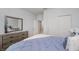 Comfortable bedroom with a large window, soft carpet, and wooden dresser with mirror at 18630 Goldwater Rd, Westfield, IN 46062